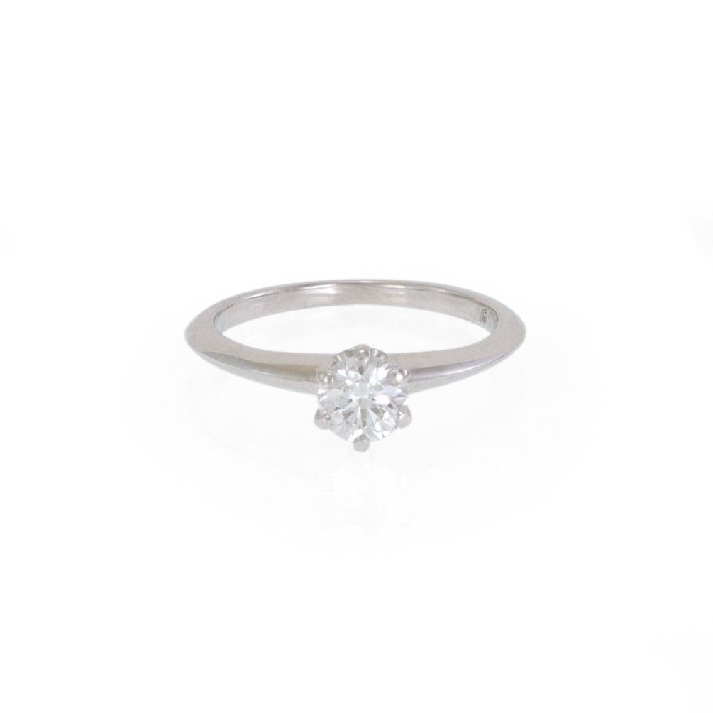 Tiffany & Co. 0.41ct Diamond Platinum Knife Edge Solitaire Ring: Tiffany & Co. 0.41ct Diamond Platinum Knife Edge Solitaire Ring Discover timeless elegance with this authentic Tiffany & Co. solitaire ring. Crafted from premium platinum, the ring features a polished