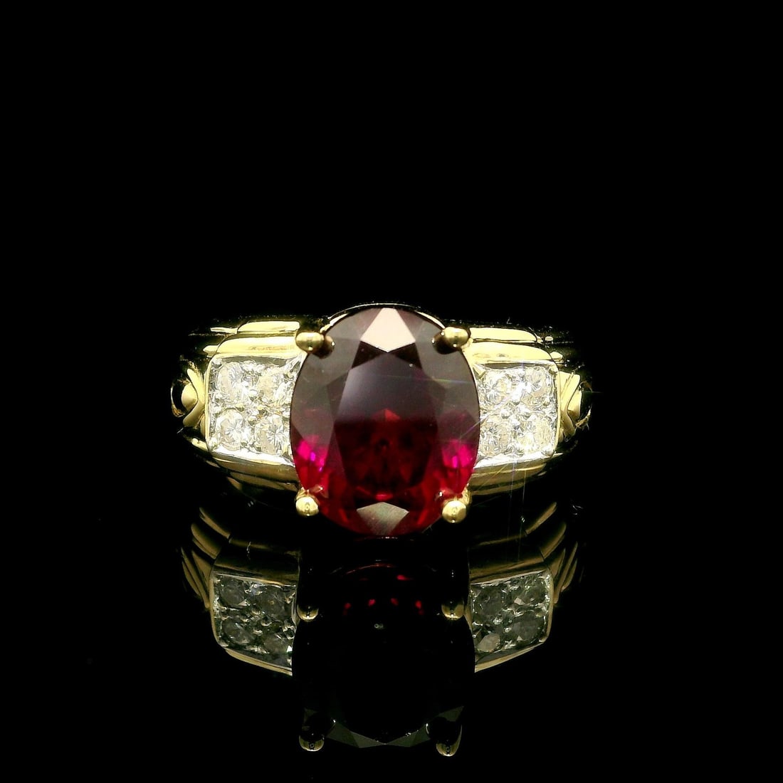 18k Yellow Gold 3.91ctw Rhodolite Garnet and Diamond Cocktail Ring: 18k Yellow Gold 3.91ctw Rhodolite Garnet and Diamond Cocktail Ring This stunning cocktail ring features a captivating 3.75ctw natural rhodolite garnet, skillfully crafted in an oval cut and prong set,