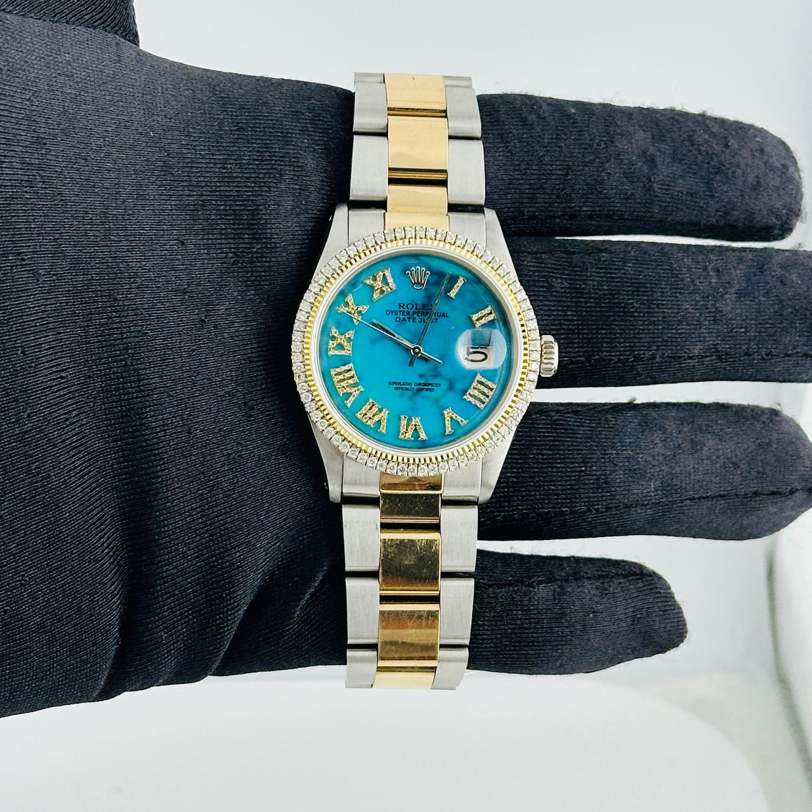 Mens Aftermarket Turquoise Roman Dial Datejust Ref 1601 Oyster Bracelet: Mens Aftermarket Turquoise Roman Dial Datejust Ref 1601 Oyster Bracelet This Rolex Datejust watch features an Aftermarket turquoise Roman numeral dial, complemented by a prong plated bezel and an Afte