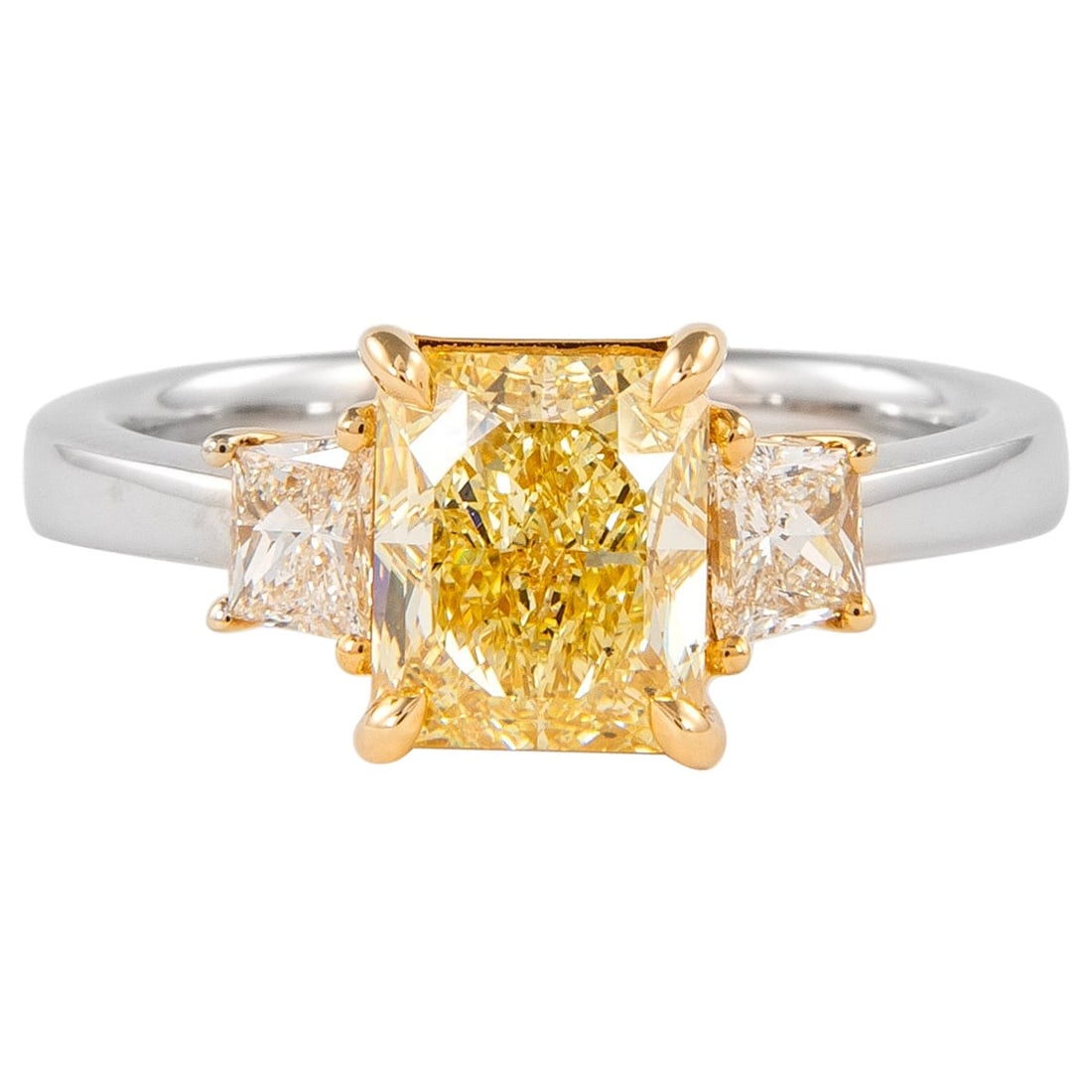 GIA 2.07ct Fancy Yellow Diamond Three-Stone Ring 18k Gold: GIA 2.07ct Fancy Yellow Diamond Three-Stone Ring 18k Gold This exquisite three-stone ring features a stunning GIA-certified 2.07ct Fancy Yellow diamond, set in a luxurious combination of 18k white and