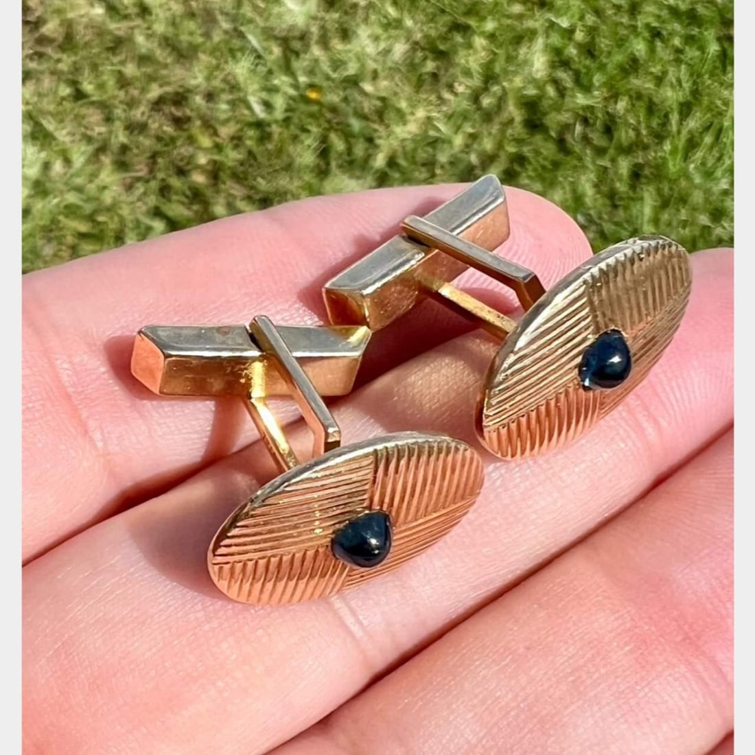 1960's Tiffany & Co. 14K Yellow Gold Sapphire Cufflinks Set: 1960's Tiffany & Co. 14K Yellow Gold Sapphire Cufflinks Set Elegant 1960's Tiffany & Co. cufflinks crafted from luxurious 14K yellow gold. These exquisite pieces feature two stunning sapphire cabochon
