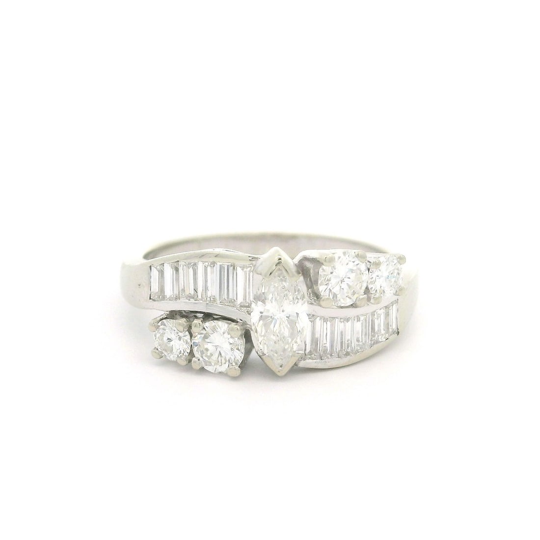 Vintage 14K White Gold 1.35ctw Diamond Ring Baguette Marquise Round: Vintage 14K White Gold 1.35ctw Diamond Ring Baguette Marquise Round This exquisite vintage ring showcases a stunning arrangement of natural genuine diamonds, featuring one marquise cut, twelve baguett