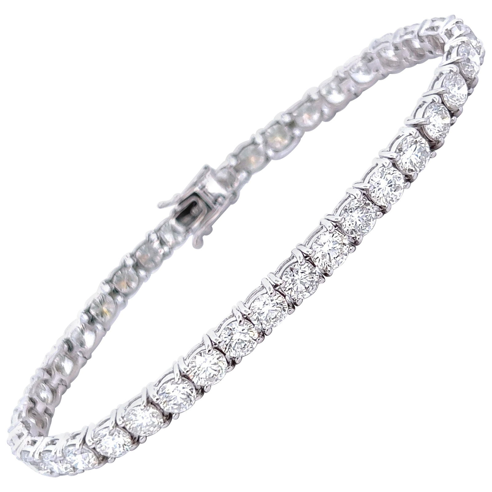 12.90ct Diamond Tennis Bracelet 18k White Gold: 12.90ct Diamond Tennis Bracelet 18k White Gold This exquisite 12.90ct diamond tennis bracelet features 37 round brilliant diamonds, averaging 0.34ct each, beautifully set in 18k white gold. The diamon