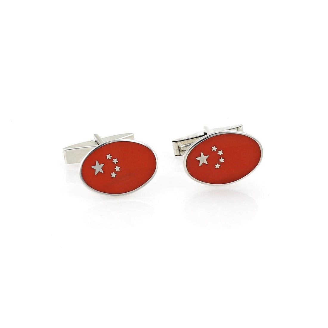Tiffany & Co. Vintage Oval Cufflinks Orange Enamel Star Design: Tiffany & Co. Vintage Oval Cufflinks Orange Enamel Star Design Elevate your accessory collection with this authentic vintage pair of cufflinks from Tiffany & Co. Made from high-quality sterling silver