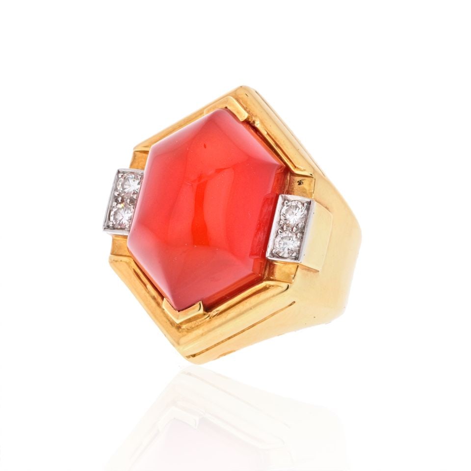 David Webb Platinum 18K Yellow Gold Carnelian Diamond Ring Estate: David Webb Platinum 18K Yellow Gold Carnelian Diamond Ring Estate This exquisite estate ring from David Webb showcases a stunning combination of platinum and 18K yellow gold. The centerpiece is a stri