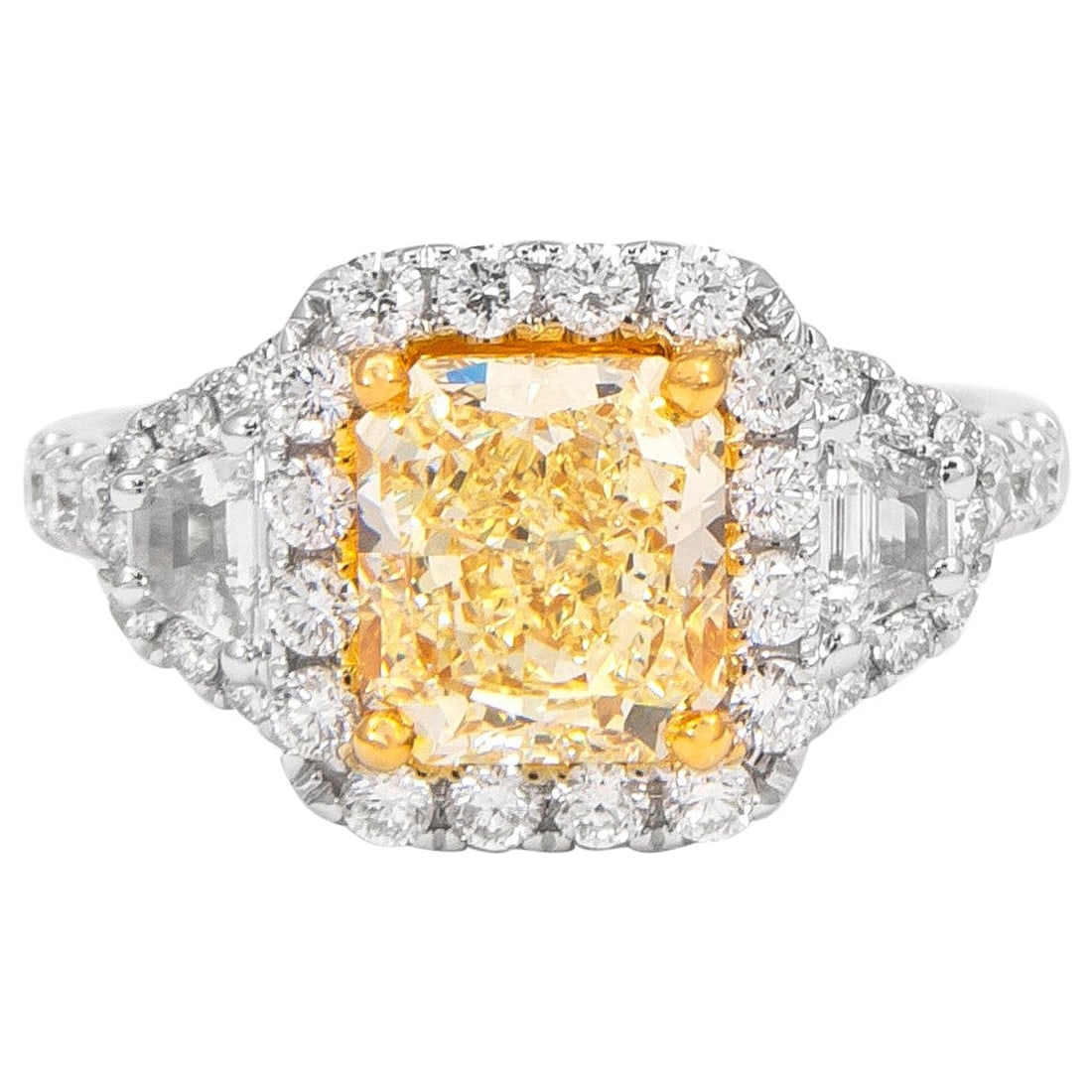 2.96ct Fancy Yellow VS1 Diamond Three-Stone Ring 18k Gold: 2.96ct Fancy Yellow VS1 Diamond Three-Stone Ring 18k Gold This exquisite GIA certified three-stone ring features a stunning 2.96 ct fancy yellow VS1 diamond at its center, complemented by two trapezoi