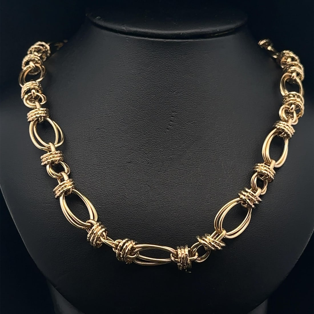 17.5 Inch 14k Yellow Gold Italian Chain Necklace With Interlocking Links: 17.5 Inch 14k Yellow Gold Italian Chain Necklace With Interlocking Links This Italian necklace features interlocking oval and textured round links, crafted in solid 14k yellow gold. Measuring 17.5 inc