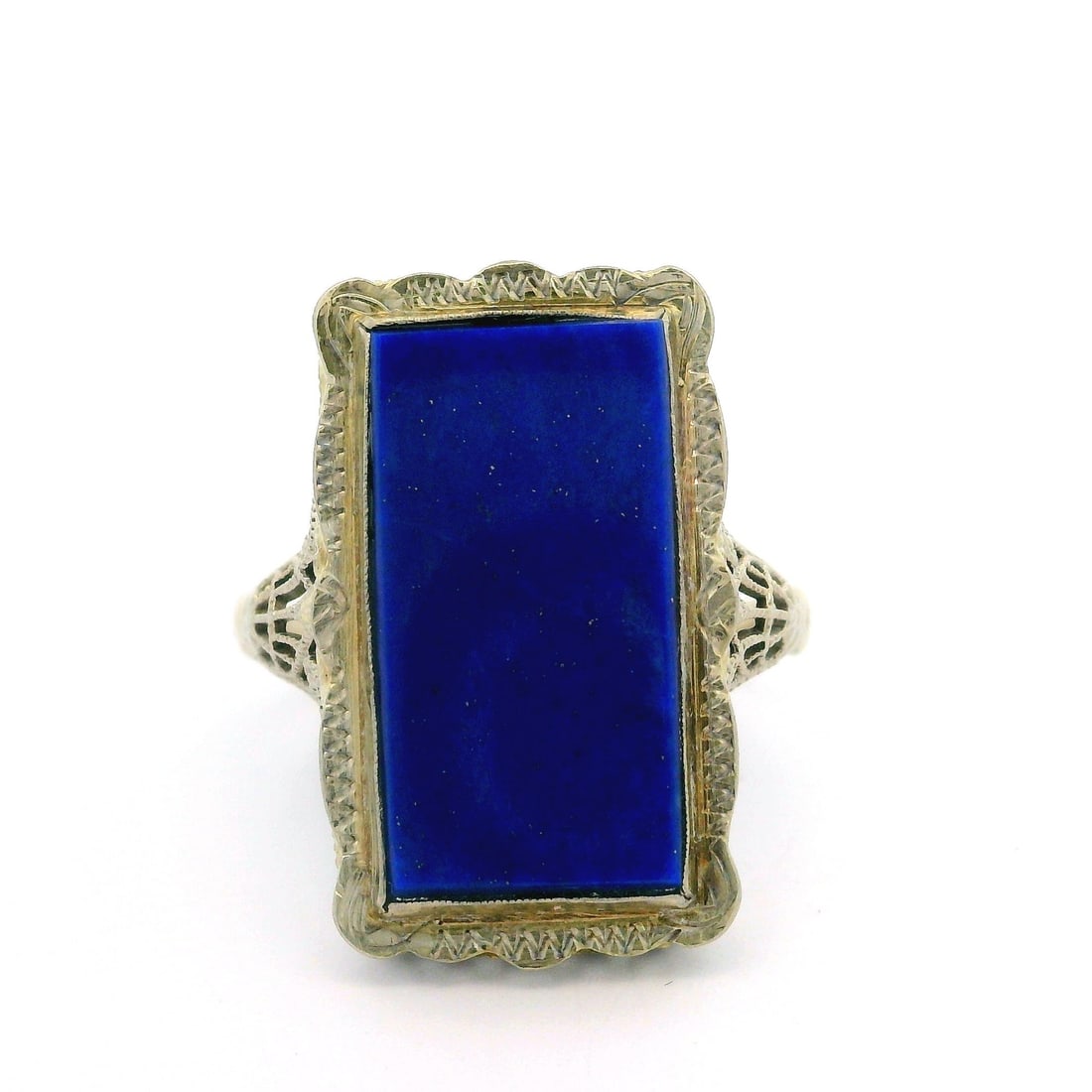 Antique 14k White Gold Rectangular Lapis Lazuli Cocktail Ring: Antique 14k White Gold Rectangular Lapis Lazuli Cocktail Ring This stunning antique cocktail ring features a large rectangular lapis lazuli stone set in 14k white gold. The vibrant cobalt blue lapis i