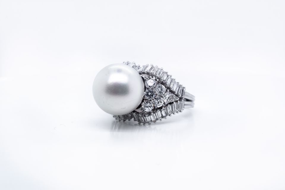 Vintage 1960's Platinum Pearl Diamond Cocktail Ring 5 Cts: Vintage 1960's Platinum Pearl Diamond Cocktail Ring 5 Cts This exquisite 1960's estate ring showcases a stunning combination of a 12.5mm white pearl and approximately 5.00 carats of sparkling diamonds