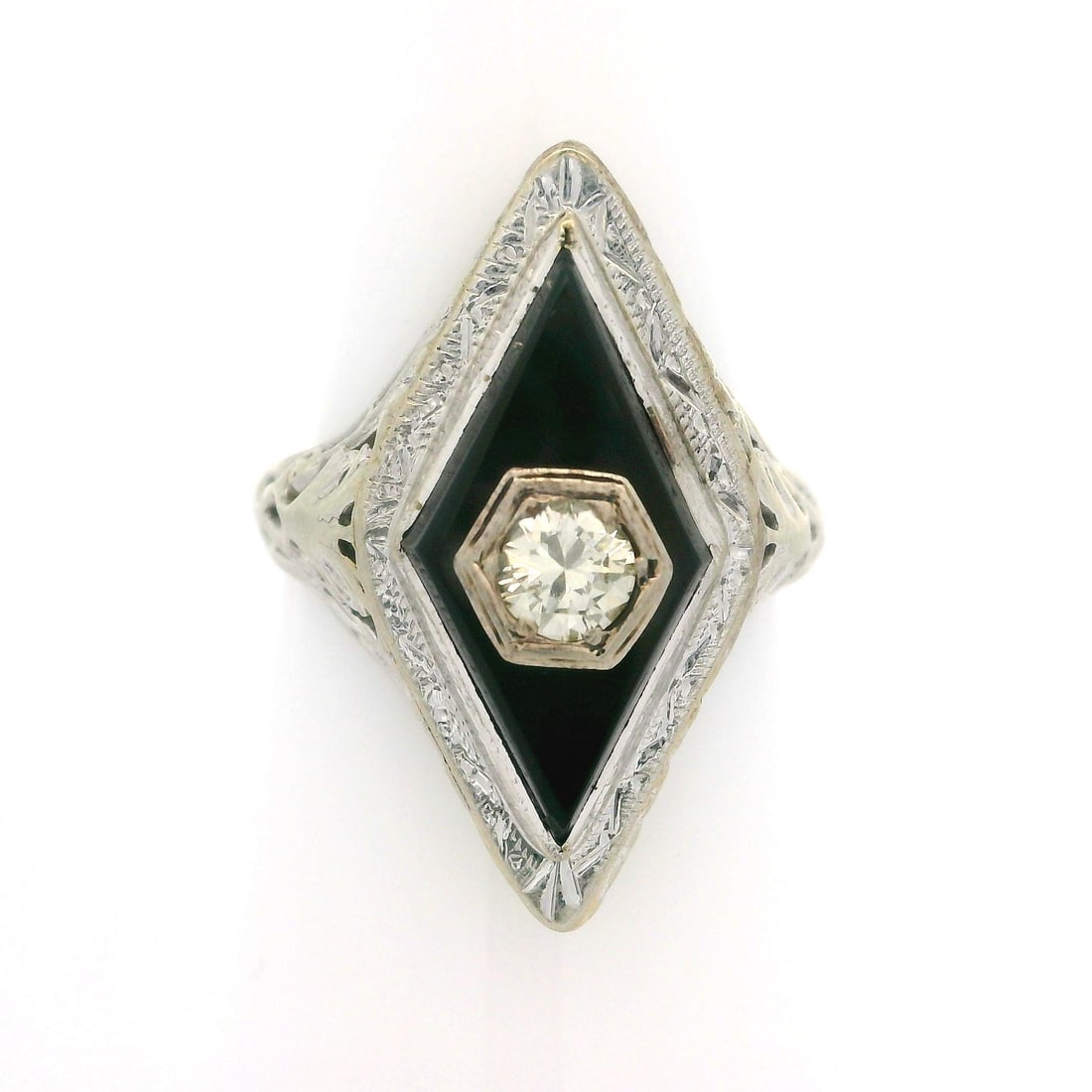 Vintage 14k White Gold Art Deco Open Work Ring with Onyx and Diamond: Vintage 14k White Gold Art Deco Open Work Ring with Onyx and Diamond This exquisite vintage cocktail ring features a stunning lozenge shape design crafted from 14k white gold. The centerpiece showcase