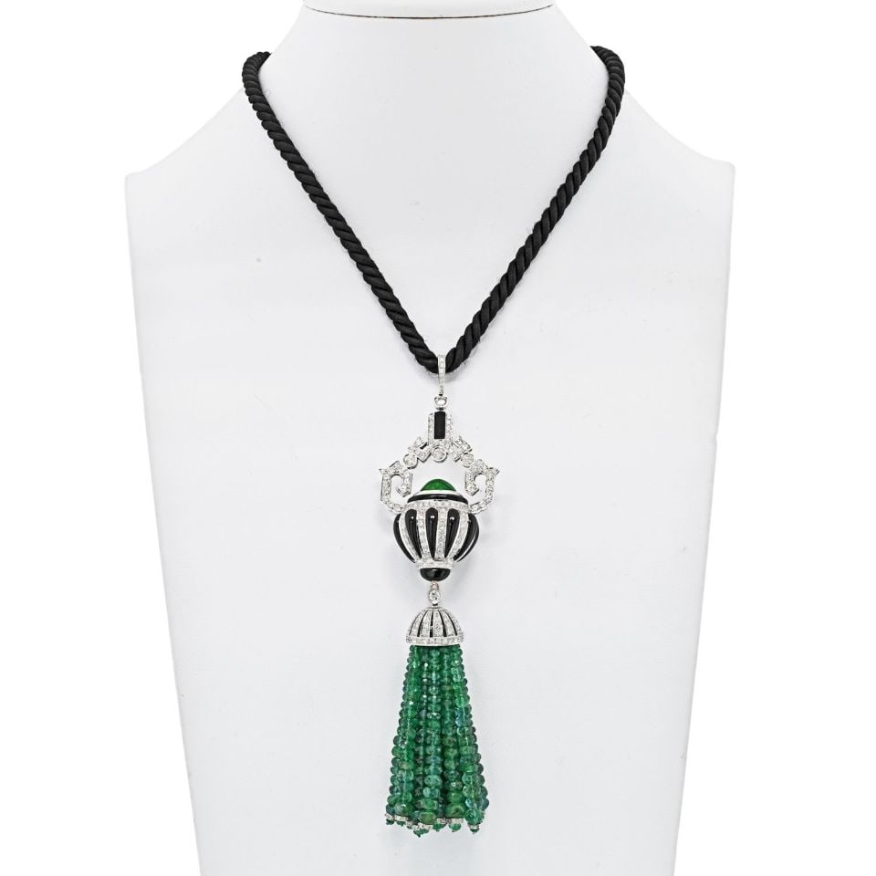 18K White Gold Art Deco Diamond Onyx Emerald Tassel Necklace: 18K White Gold Art Deco Diamond Onyx Emerald Tassel Necklace This exquisite 18K white gold estate necklace showcases a stunning tassel design adorned with natural emerald beads, diamonds, and onyx acc