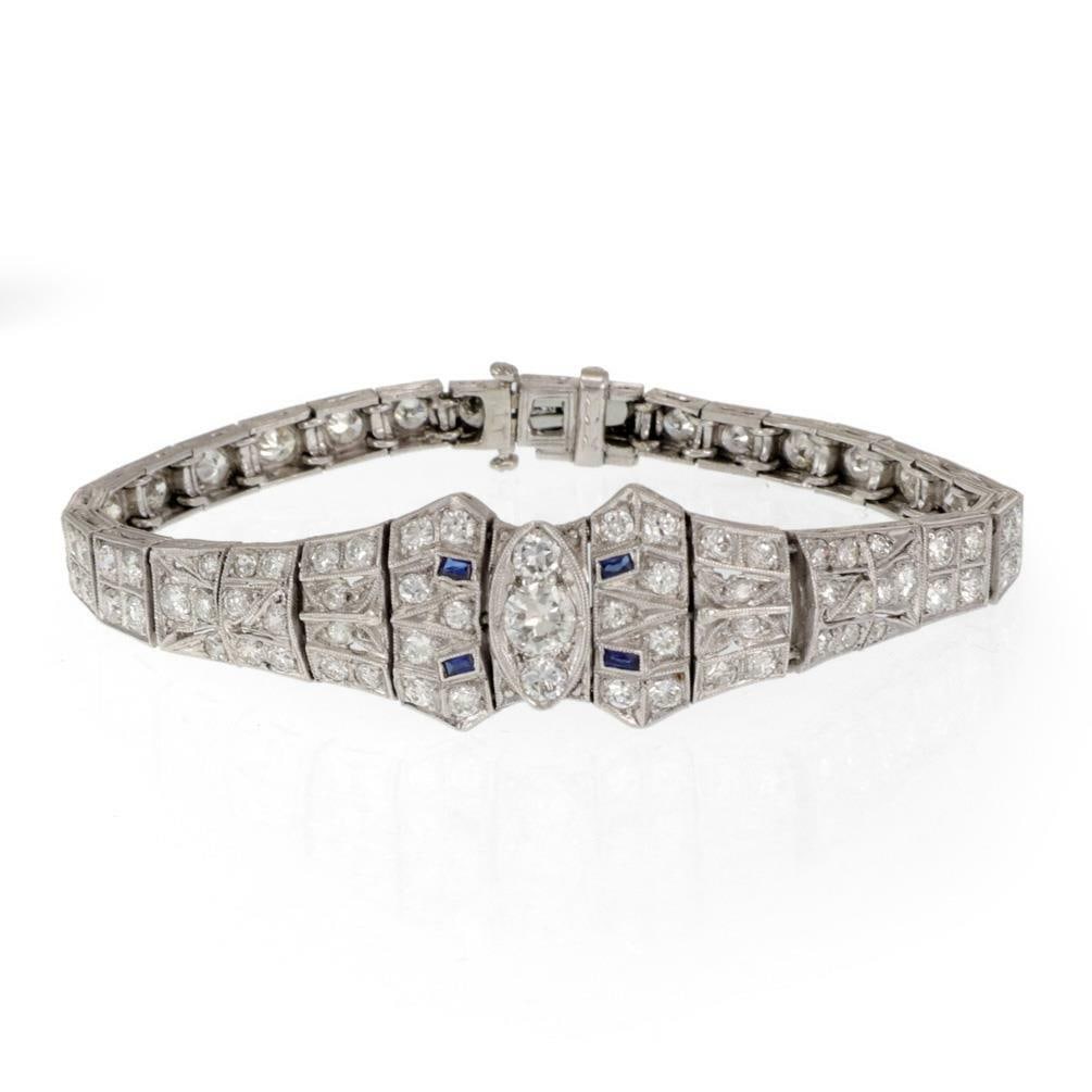Elegant Art Deco Platinum Bracelet with 3.00 Carats Diamonds and Blue Accents: Elegant Art Deco Platinum Bracelet with 3.00 Carats Diamonds and Blue Accents This exquisite Art Deco bracelet is a stunning example of vintage elegance, expertly crafted from platinum. The bracelet f