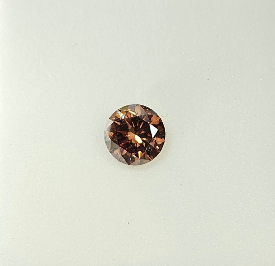 Loose Diamond - ROUND 1.07ct Fancy Dark Orange Brown SI1: Loose Diamond - ROUND 1.07ct Fancy Dark Orange Brown SI1 Source: Natural Shape: ROUND Carats: 1.07 Color: Fancy Dark Orange Brown Certification: GIA PLEASE NOTE: Framed, Large, or heavy items do not h