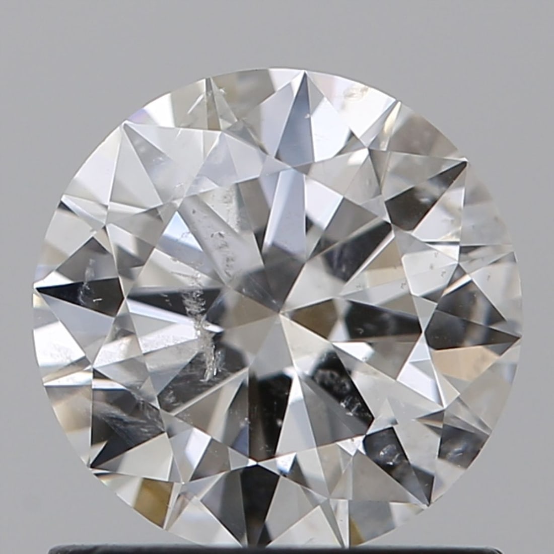 Loose Diamond - ROUND 1.0ct E I1: Loose Diamond - ROUND 1.0ct E I1 Source: Natural Shape: ROUND Carats: 1.0 Color: E Clarity: I1 Certification: GIA Video: