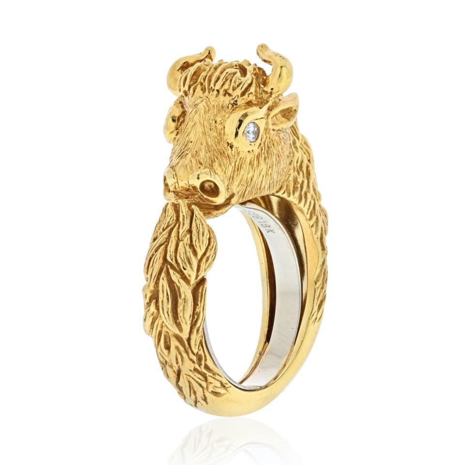 David Webb 18K Yellow Gold Bull Ring with Diamond Eyes Estate Jewelry: David Webb 18K Yellow Gold Bull Ring with Diamond Eyes Estate Jewelry This exquisite David Webb ring showcases a charming baby bull design, meticulously crafted in 18K yellow gold. The ring is adorned