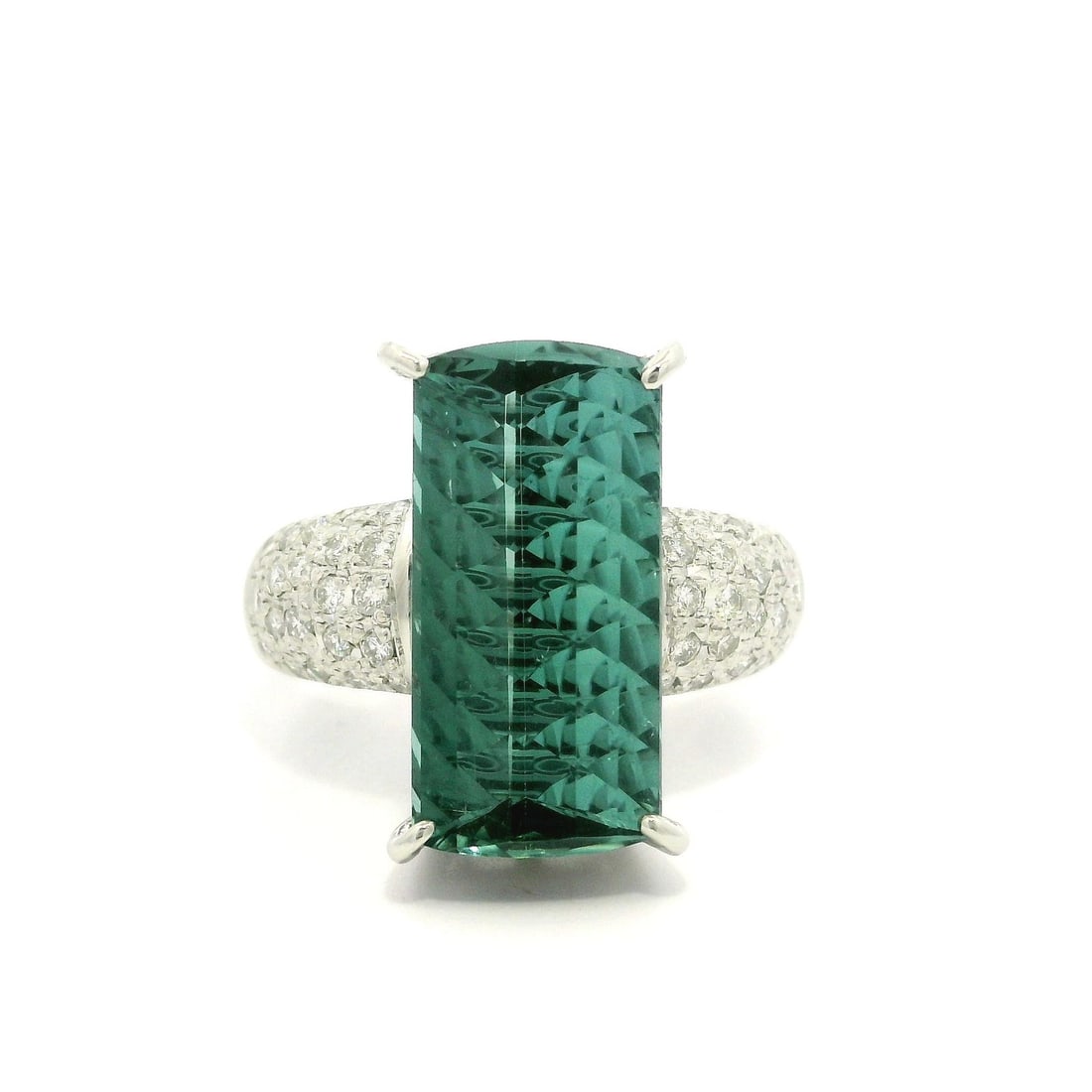 Platinum GIA 7.87ct Fantasy Cut Blue Green Tourmaline Diamond Ring: Platinum GIA 7.87ct Fantasy Cut Blue Green Tourmaline Diamond Ring This stunning cocktail ring features a captivating natural blue green tourmaline with a unique modified rectangular fantasy cut, weig