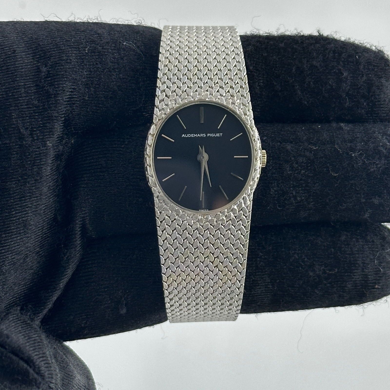 Ladies Cobra Mesh Bracelet Watch with Black Stick Dial by Audemars Piguet: Ladies Cobra Mesh Bracelet Watch with Black Stick Dial by Audemars Piguet This Audemars Piguet Cobra watch features a ladies' mesh-style bracelet and a black stick dial. The timepiece is part of the C