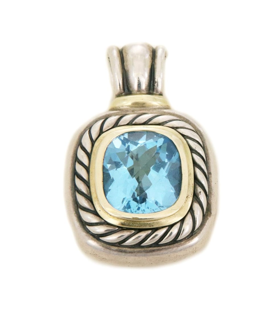David Yurman Noblesse Pendant Blue Topaz 14k Gold Sterling Silver: David Yurman Noblesse Pendant Blue Topaz 14k Gold Sterling Silver This exquisite pendant from David Yurman's Noblesse Collection showcases a stunning blue topaz gemstone elegantly framed in 14k yellow