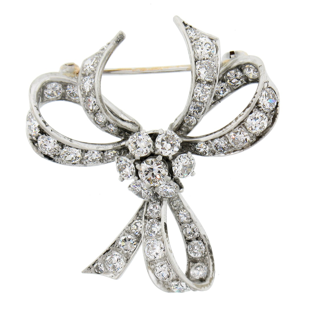 Vintage Platinum 1.95ct Old Cut Diamond Ribbon Bow Brooch: Vintage Platinum 1.95ct Old Cut Diamond Ribbon Bow Brooch This exquisite vintage brooch features a stunning ribbon bow design crafted from solid platinum. Adorned with 49 natural genuine diamonds, inc
