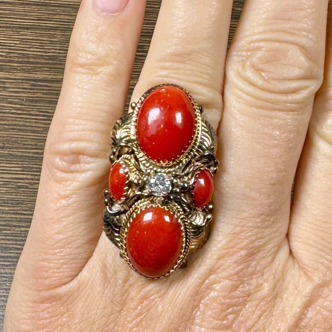 1960's 14K Yellow Gold Coral Diamond Ring 0.30 Ct Vintage: 1960's 14K Yellow Gold Coral Diamond Ring 0.30 Ct Vintage This stunning 1960's ring showcases a beautiful blend of 14K yellow gold, vibrant coral, and sparkling diamond. Weighing 14.4 grams, this piec