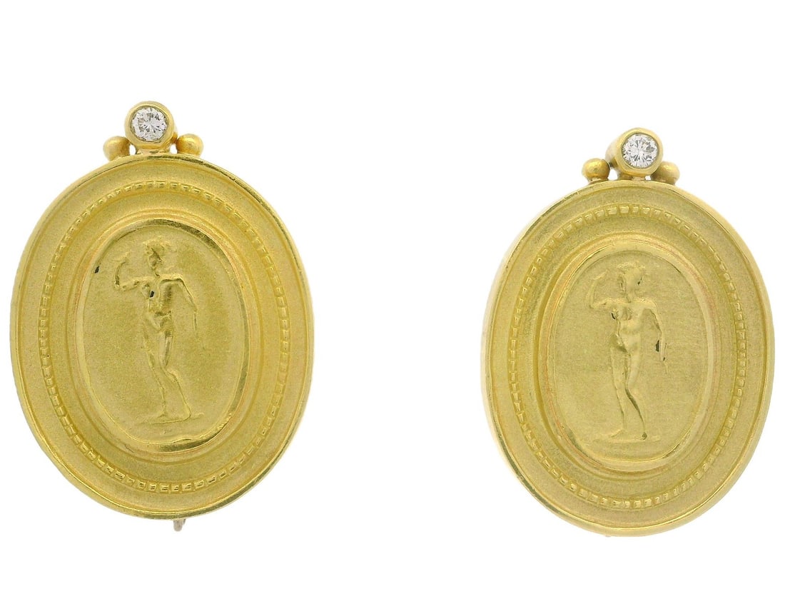 18K Yellow Gold Diamond Goddess Cameo Omega Earrings: 18K Yellow Gold Diamond Goddess Cameo Omega Earrings Elevate your accessory collection with these stunning 18k Yellow Gold Diamond Goddess Statue Cameo Button Omega Earrings. Crafted from solid 18K ye