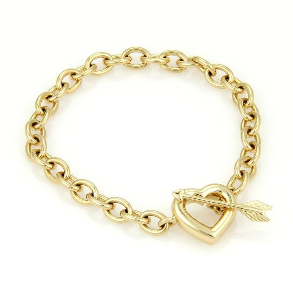 Tiffany & Co. Cupid's Bracelet 18K Yellow Gold Heart Toggle Clasp: Tiffany & Co. Cupid's Bracelet 18K Yellow Gold Heart Toggle Clasp Discover the timeless elegance of this authentic Tiffany & Co. Cupid's Bracelet from the renowned Cupid's collection. Crafted in luxur