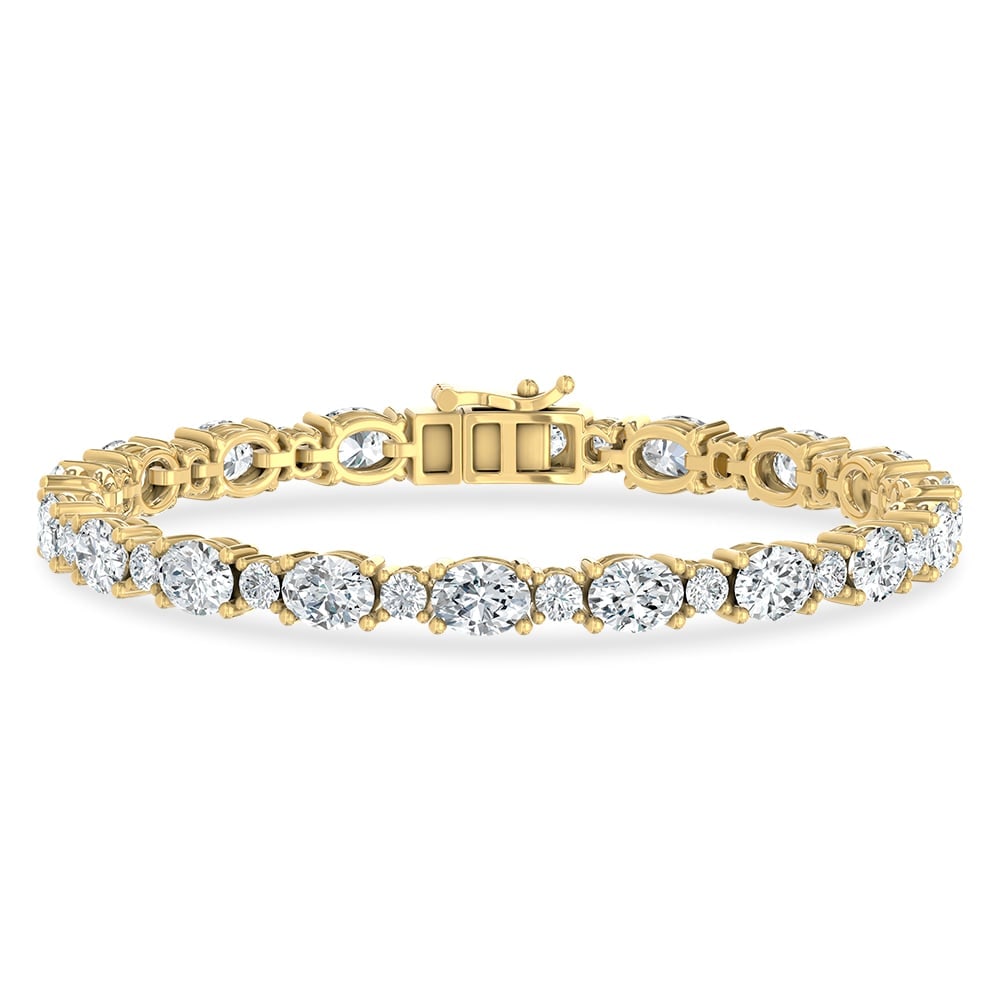 14K Yellow Gold Lab Grown Diamond 11 Ct.Tw. Oavl and Round Fancy Bracelet: 14K Yellow Gold Lab Grown Diamond 11 Ct.Tw. Oavl and Round Fancy Bracelet Crafted in sleek 14K Yellow Gold, this oval and round fancy bracelet is adorned with lab grown diamonds totaling 11 Ct.Tw., de