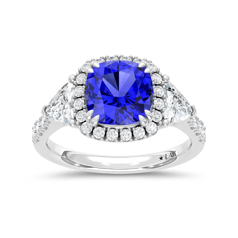 14K White Gold Lab Grown Diamond 4 Ct.Tw. Cushion Shape Recrystalized Blue Sapphire Engagement Ring: 14K White Gold Lab Grown Diamond 4 Ct.Tw. Cushion Shape Recrystalized Blue Sapphire Engagement Ring (Center 2 3/4 ct) Exude timeless elegance with this 14K white gold engagement ring, featuring a radi