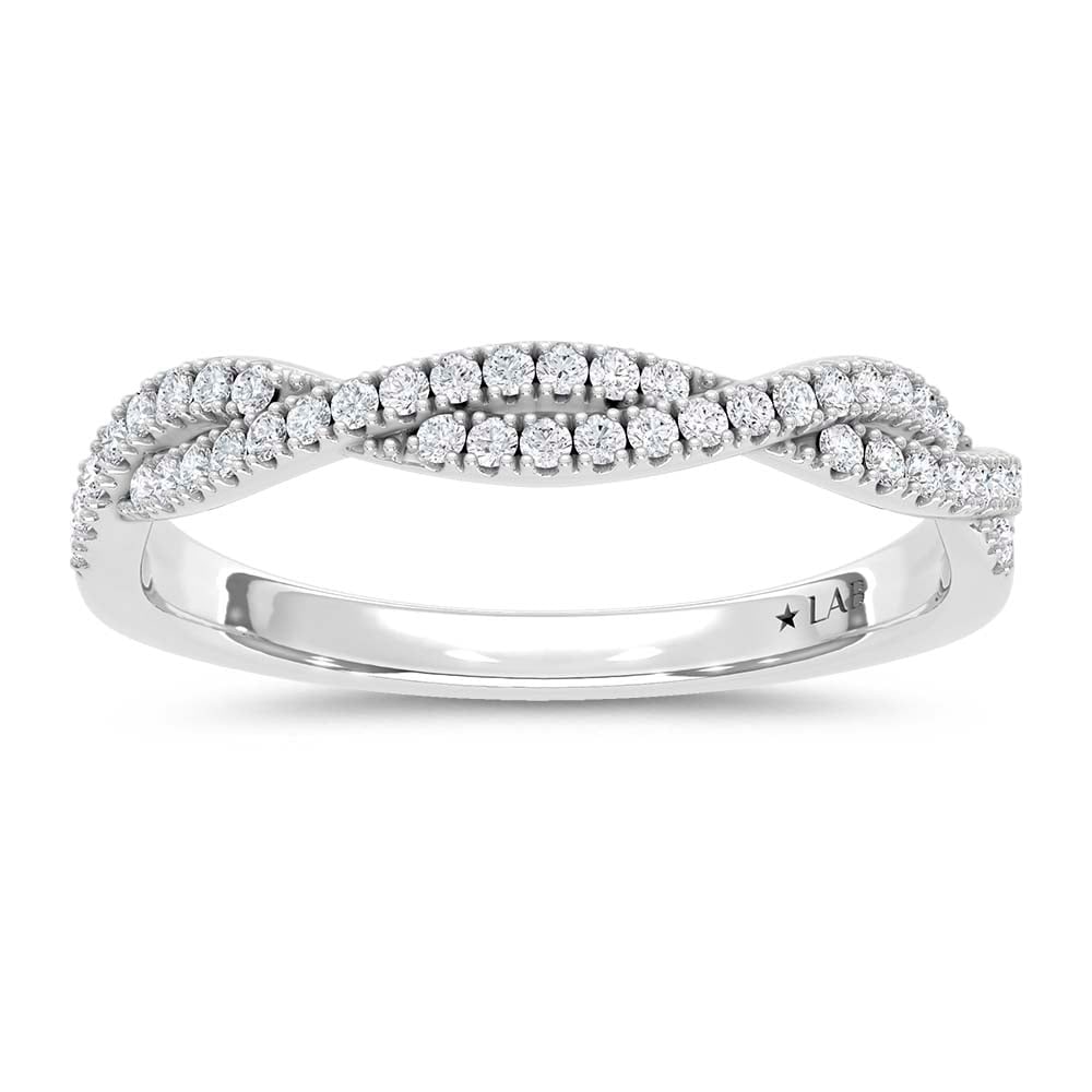 14K White Gold Lab Grown Round Diamond 1/5 Ct.Tw. Wedding Band: 14K White Gold Lab Grown Round Diamond 1/5 Ct.Tw. Wedding Band This elegant 14K White Gold Wedding Band, featuring 1/5 Ct.Tw. of round Lab Grown Diamonds, is a luxurious testament to timeless beauty.