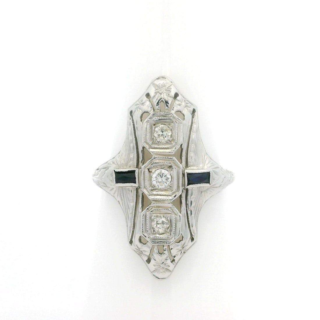 Antique Art Deco 18k White Gold Diamond Sapphire Cocktail Ring: Antique Art Deco 18k White Gold Diamond Sapphire Cocktail Ring This exquisite Antique Art Deco dinner ring showcases a stunning combination of natural diamonds and synthetic sapphires set in solid