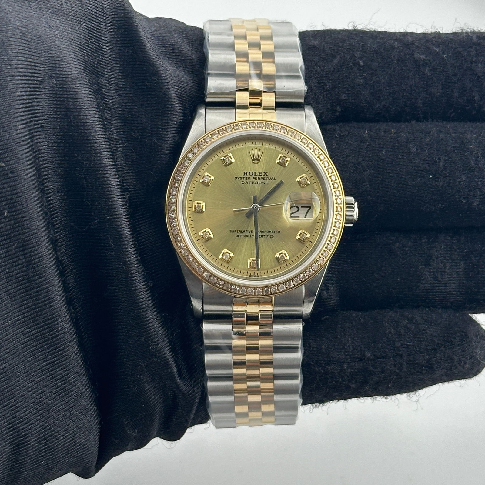 Aftermarket Champagne Diamond Dial Jubilee Watch Ref 1601: Aftermarket Champagne Diamond Dial Jubilee Watch Ref 1601 Rolex Datejust watch featuring an aftermarket champagne diamond dial, aftermarket Jubilee bracelet, and a reference number 1601. The watch