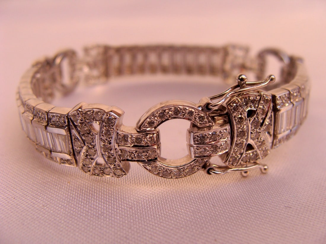 1950s French 18K White Gold Diamond Bracelet 4.25 ct: 1950s French 18K White Gold Diamond Bracelet 4.25 ct This exquisite 1950's French bracelet is crafted from 18K white gold and adorned with approximately 4.25 ct of dazzling white diamonds. The charm-s
