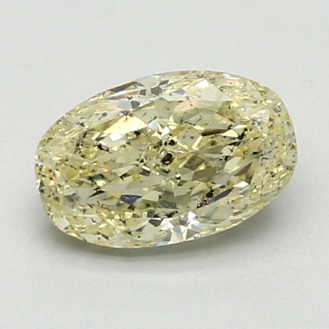 Loose Diamond - OVAL 1.52ct Fancy Light Yellow: Loose Diamond - OVAL 1.52ct Fancy Light Yellow Source: Natural Shape: OVAL Carats: 1.52 Color: Fancy Light Yellow Certification: GIA Video: