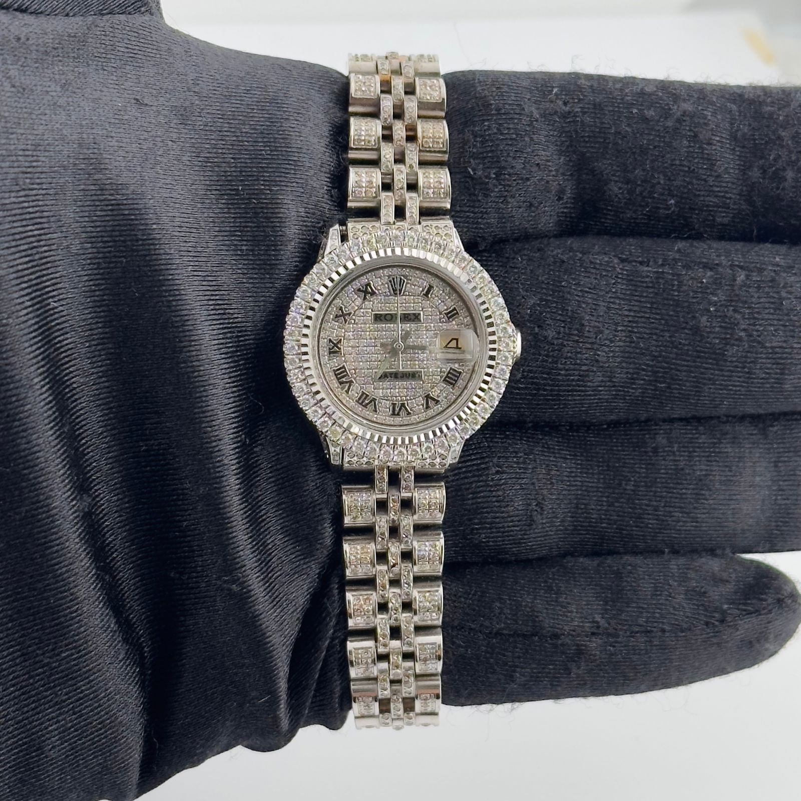Rolex Ladies Datejust 6524 Aftermarket Iced Roman Dial Jubilee Bracelet: Rolex Ladies Datejust 6524 Aftermarket Iced Roman Dial Jubilee Bracelet This is a ladies Rolex Datejust watch featuring an iced out Roman numeral dial and a prong-set bezel. The watch includes an afte