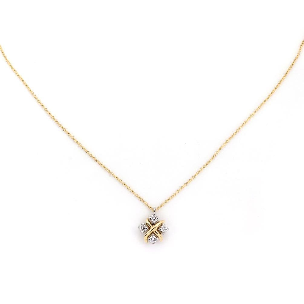 Tiffany & Co. 18k Gold Platinum Diamond X Pendant Chain: Tiffany & Co. 18k Gold Platinum Diamond X Pendant Chain This elegant pendant and chain from Tiffany & Co. features a stunning X design crafted from 18k yellow gold, accented with a round cut diamond s