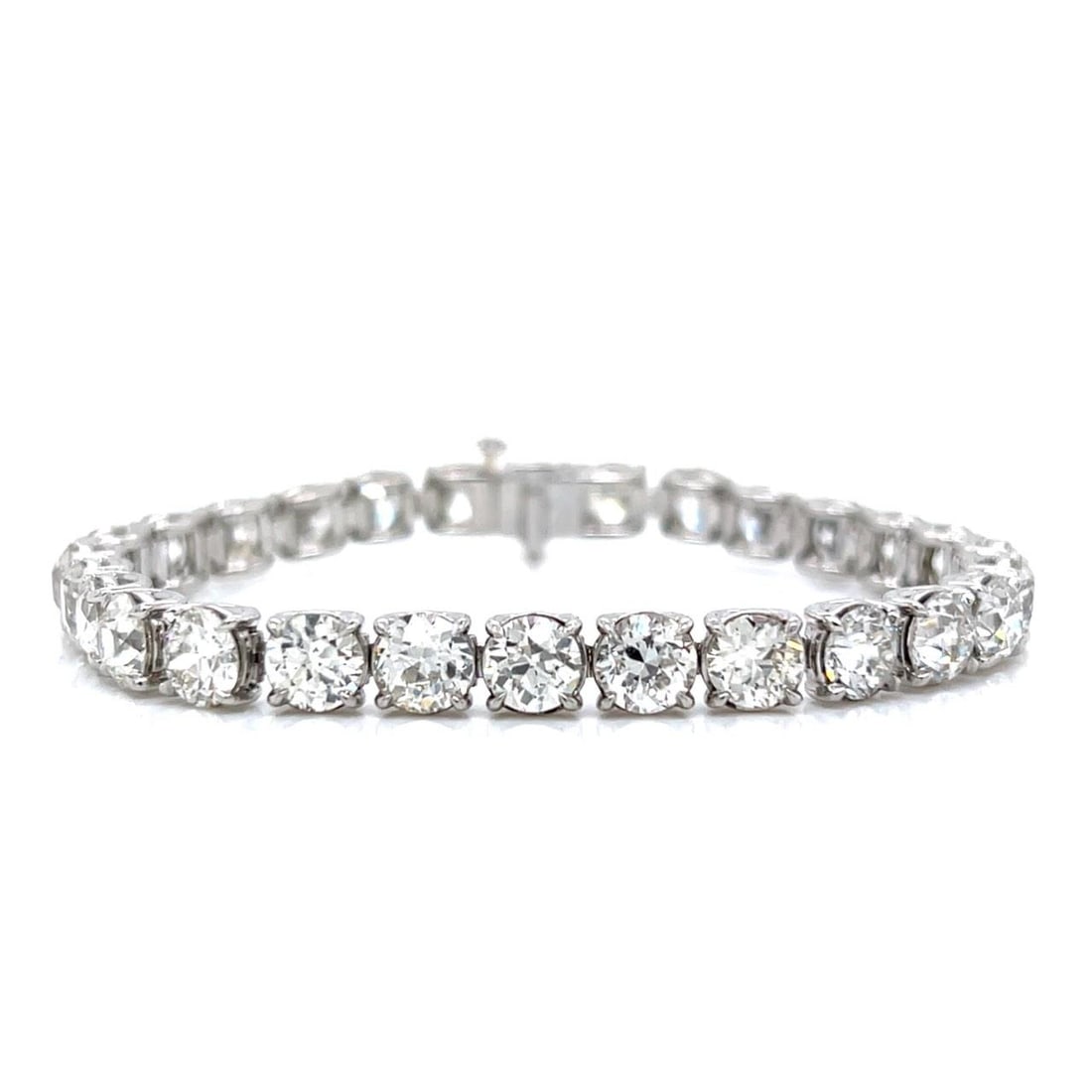 Platinum 19 Ct European-Cut Diamond Tennis Bracelet 28 Stones: Platinum 19 Ct European-Cut Diamond Tennis Bracelet 28 Stones This exquisite tennis bracelet showcases a stunning array of 28 European-cut diamonds, collectively weighing approximately 19.00 ct. Craft