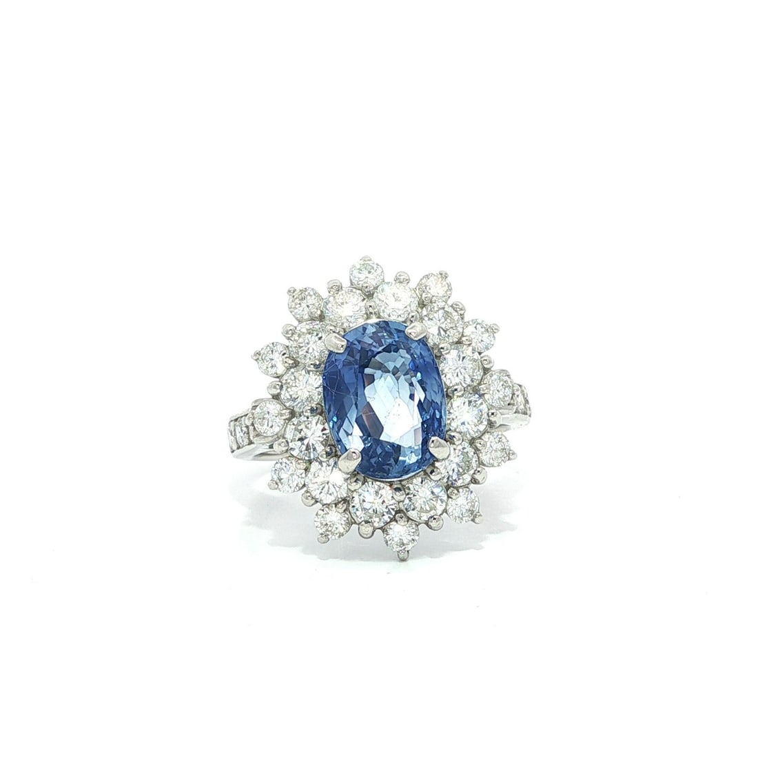 Platinum GIA 3.58ct Ceylon Blue Sapphire Diamond Halo Cocktail Ring: Platinum GIA 3.58ct Ceylon Blue Sapphire Diamond Halo Cocktail Ring This stunning cocktail style ring features a breathtaking natural Ceylon cornflower blue sapphire, weighing 3.58 carats, elegantly s