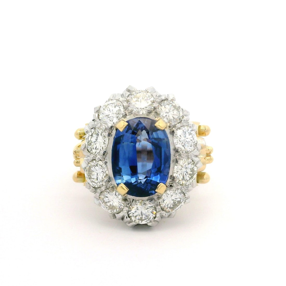 Vintage 18k Gold Sapphire Diamond Scroll Ring GIA Certified 6.31ctw: Vintage 18k Gold Sapphire Diamond Scroll Ring GIA Certified 6.31ctw This exquisite vintage cocktail ring showcases a stunning 4.51-carat natural blue sapphire, beautifully set in an 18k yellow gold ba