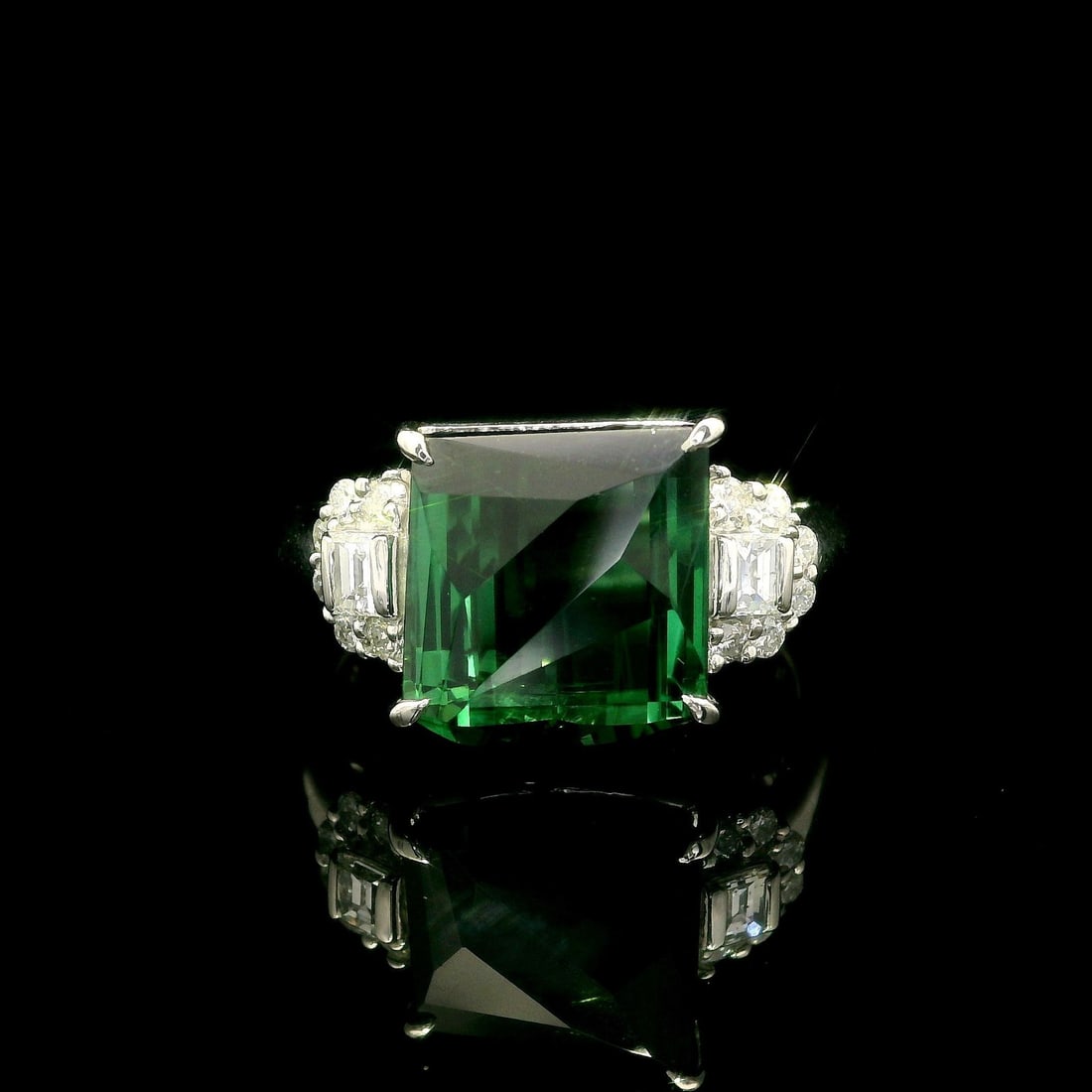 Platinum 6.65ct Green Tourmaline Cocktail Ring with Diamond Accents: Platinum 6.65ct Green Tourmaline Cocktail Ring with Diamond Accents This exquisite cocktail ring features a stunning 6.65ct cushion-cut green tourmaline, prong set in solid platinum. The vibrant natur