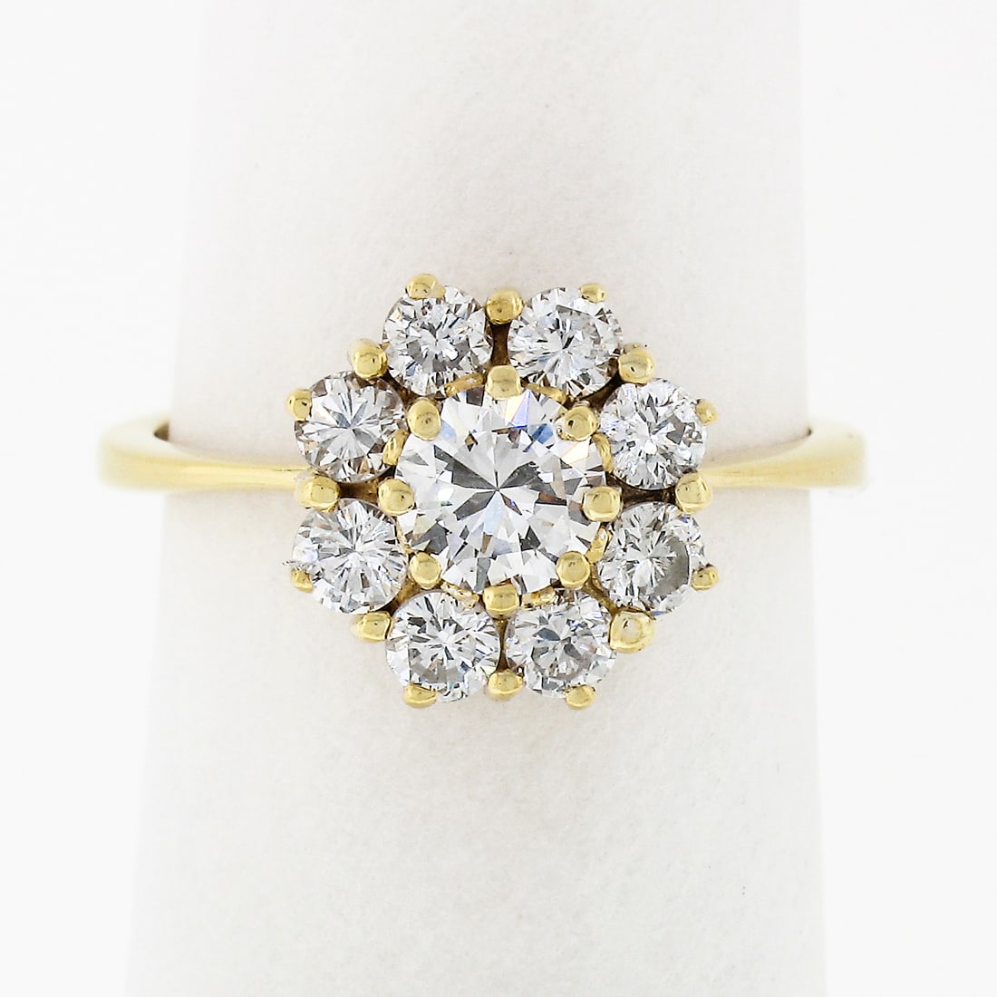 18k Yellow Gold 0.93ctw Petite Flower Diamond Cluster Ring: 18k Yellow Gold 0.93ctw Petite Flower Diamond Cluster Ring This exquisite ring showcases a beautiful flower cluster design, meticulously crafted in solid 18k yellow gold. The centerpiece features a ro