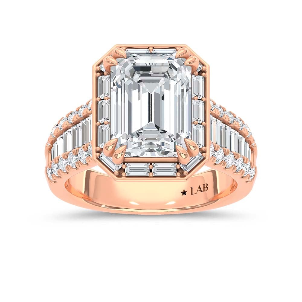 14K Rose Gold Lab Grown Diamond 6 1/4 Ct.Tw. Emerald Shape Engagement Ring (IGI Certified Center 5ct: 14K Rose Gold Lab Grown Diamond 6 1/4 Ct.Tw. Emerald Shape Engagement Ring (IGI Certified Center 5ct Emerald) Make a bold statement with this luxurious 14K Rose gold engagement ring, featuring a breat