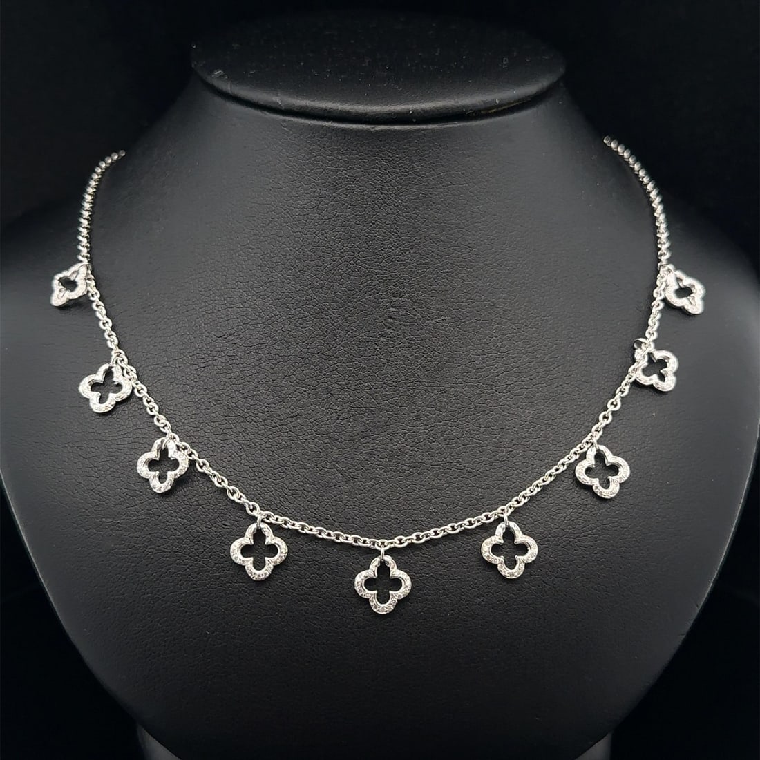 Elegant White Gold 0.40ctw Diamond Quatrefoil Flower Dangle Necklace: Elegant White Gold 0.40ctw Diamond Quatrefoil Flower Dangle Necklace This exquisite Y-Drop necklace showcases a stunning quatrefoil flower design, accentuated by numerous natural, genuine diamonds. Th