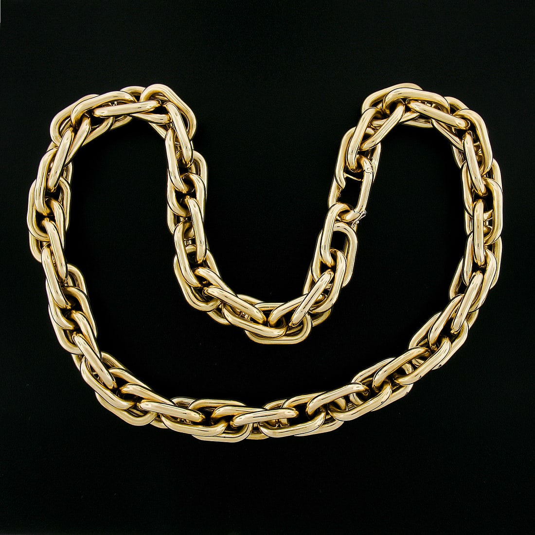Nicolis Cola 18K Yellow Gold 23" Wide Interlocking Oval Link Necklace: Nicolis Cola 18K Yellow Gold 23" Wide Interlocking Oval Link Necklace This stunning necklace by Nicolis Cola features a wide interlocking triple oval link design, crafted from solid 18K yellow gold. W