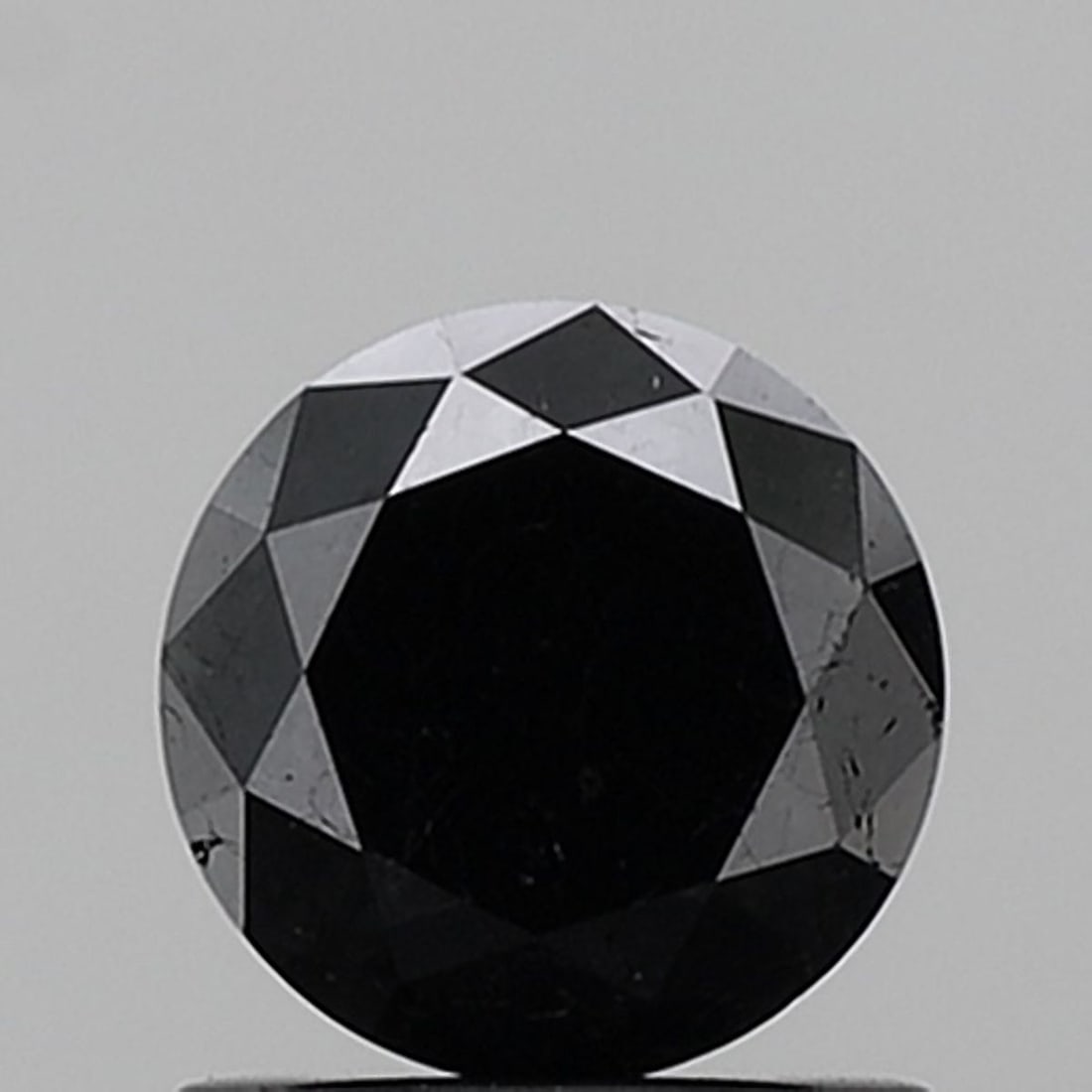 Loose Diamond - ROUND 0.99ct Fancy Black VS2: Loose Diamond - ROUND 0.99ct Fancy Black VS2 Source: Natural Shape: ROUND Carats: 0.99 Color: Fancy Black Certification: NONE Video: Video Link PLEASE NOTE: Framed, Large, or heavy items do not