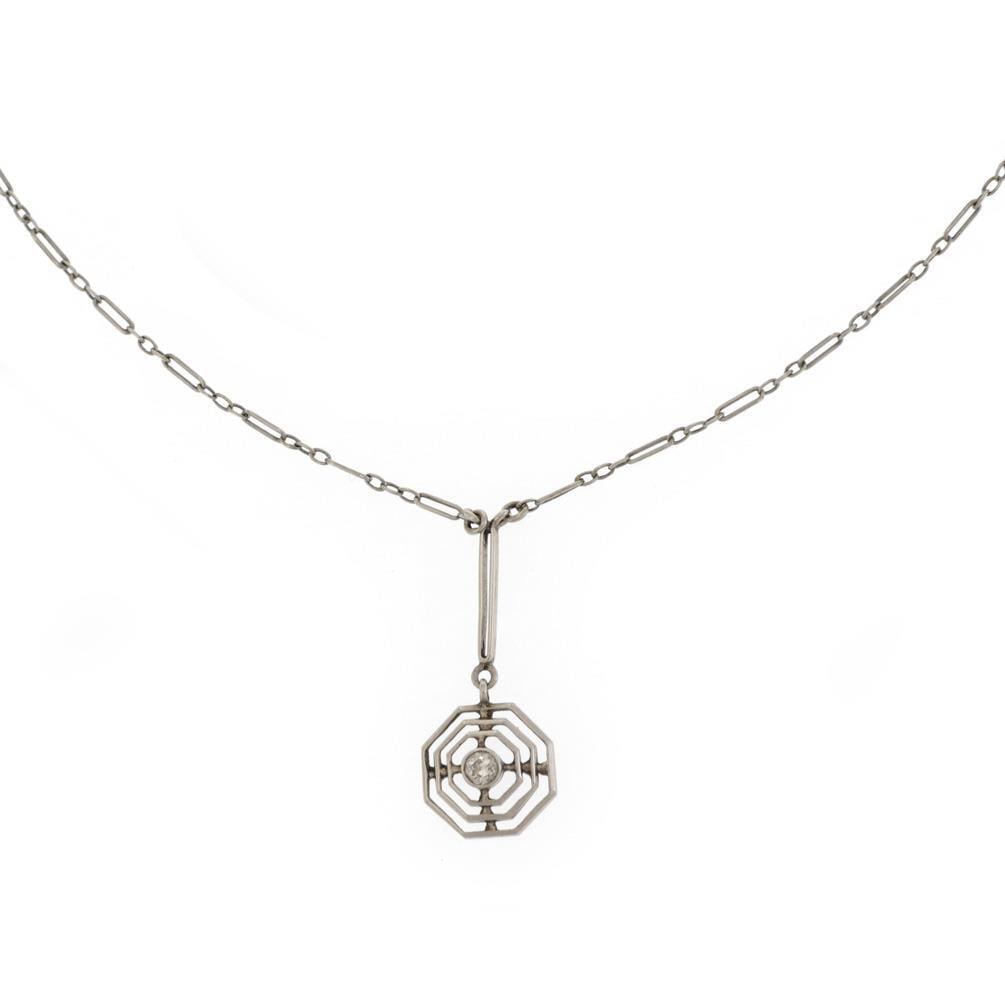 Vintage 10k White Gold Octagonal Pendant with 7-Point Diamond & Chain: Vintage 10k White Gold Octagonal Pendant with 7-Point Diamond & Chain This stunning vintage pendant and chain set is expertly crafted from 10k white gold. The pendant showcases a unique octagonal desi