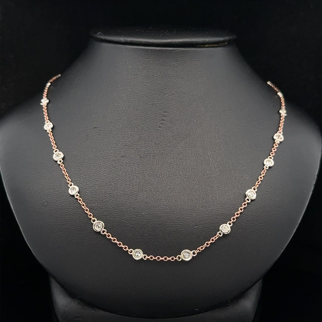 14k Rose Gold Adjustable Necklace with White Gold Diamond Stations: 14k Rose Gold Adjustable Necklace with White Gold Diamond Stations This exquisite adjustable necklace features a stunning combination of solid 14k rose gold and white gold. The design includes (24) na