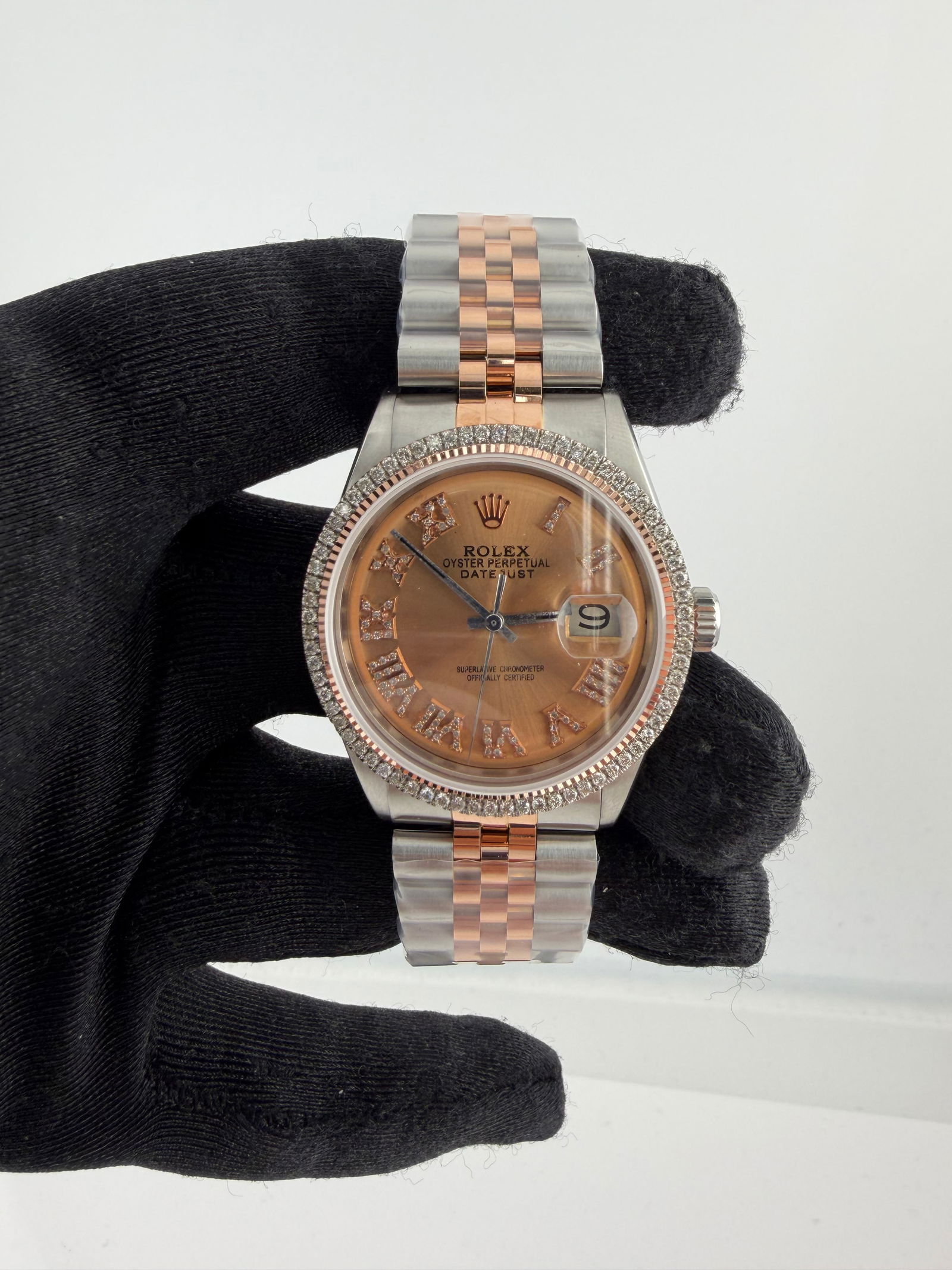 AM Pink Roman Diamond Dial Jubilee Bracelet for Rolex Datejust Ref 1601: AM Pink Roman Diamond Dial Jubilee Bracelet for Rolex Datejust Ref 1601 This Rolex Datejust watch features an aftermarket pink Roman diamond dial and an aftermarket Jubilee bracelet. The timepiece inc