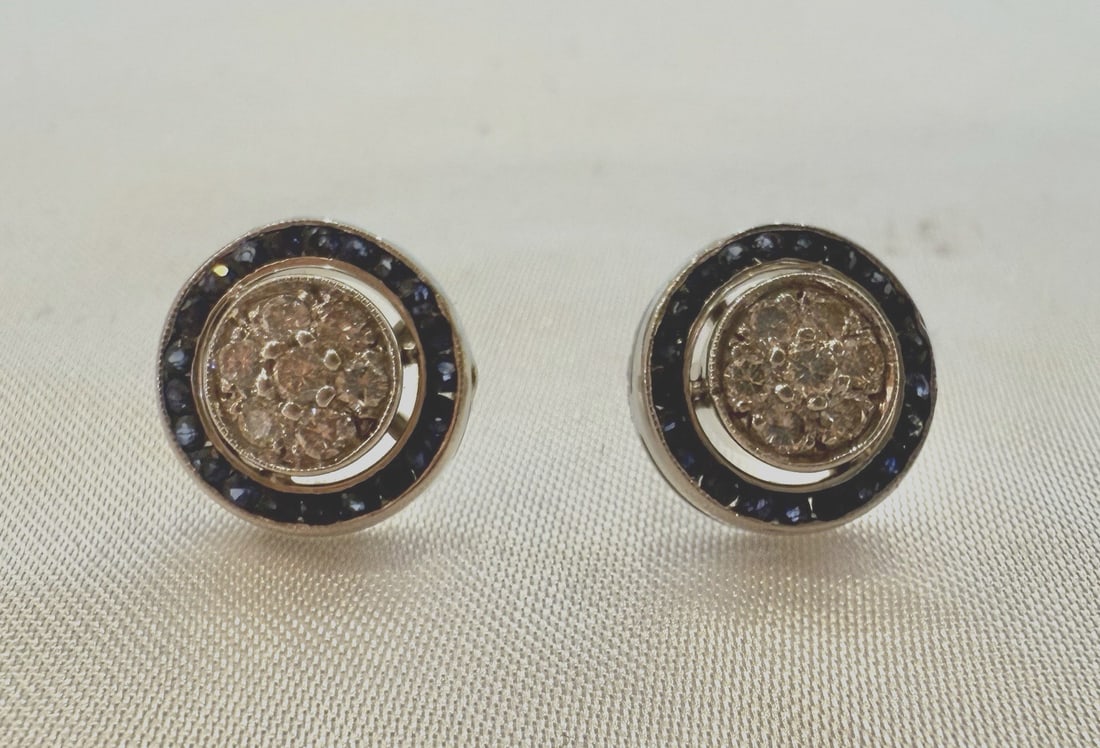 Exquisite 14K White Gold Diamond Sapphire Stud Earrings: Exquisite 14K White Gold Diamond Sapphire Stud Earrings This exquisite pair of earrings is crafted from 14K white gold and features stunning diamonds and sapphires. Weighing 4.60 grams, the earrings