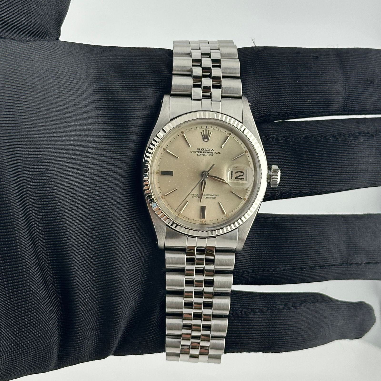 Rolex Datejust Ref 1601/4 Men's Watch Silver Stick Dial Jubilee Bracelet: Rolex Datejust Ref 1601/4 Men's Watch Silver Stick Dial Jubilee Bracelet This Rolex Datejust features a silver stick dial and a fluted bezel, paired with a Jubilee bracelet. The watch is designed for