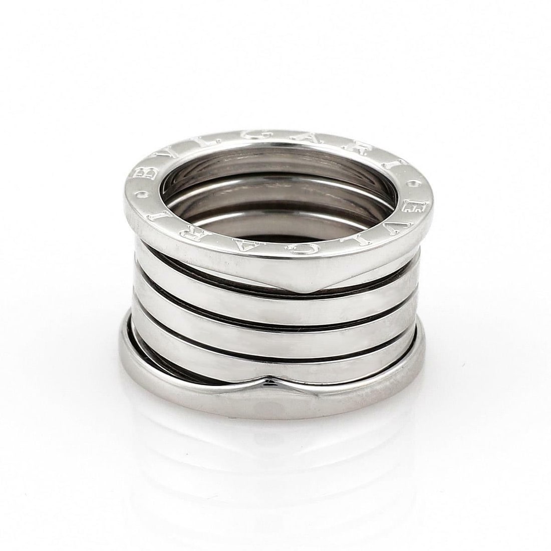Bvlgari B Zero-1 18k White Gold Flex Ring EU 50 US 5: Bvlgari B Zero-1 18k White Gold Flex Ring EU 50 US 5 This exquisite Bulgari B Zero-1 band ring is crafted from 18k white gold, showcasing the brand's renowned craftsmanship. With a comfortable width o